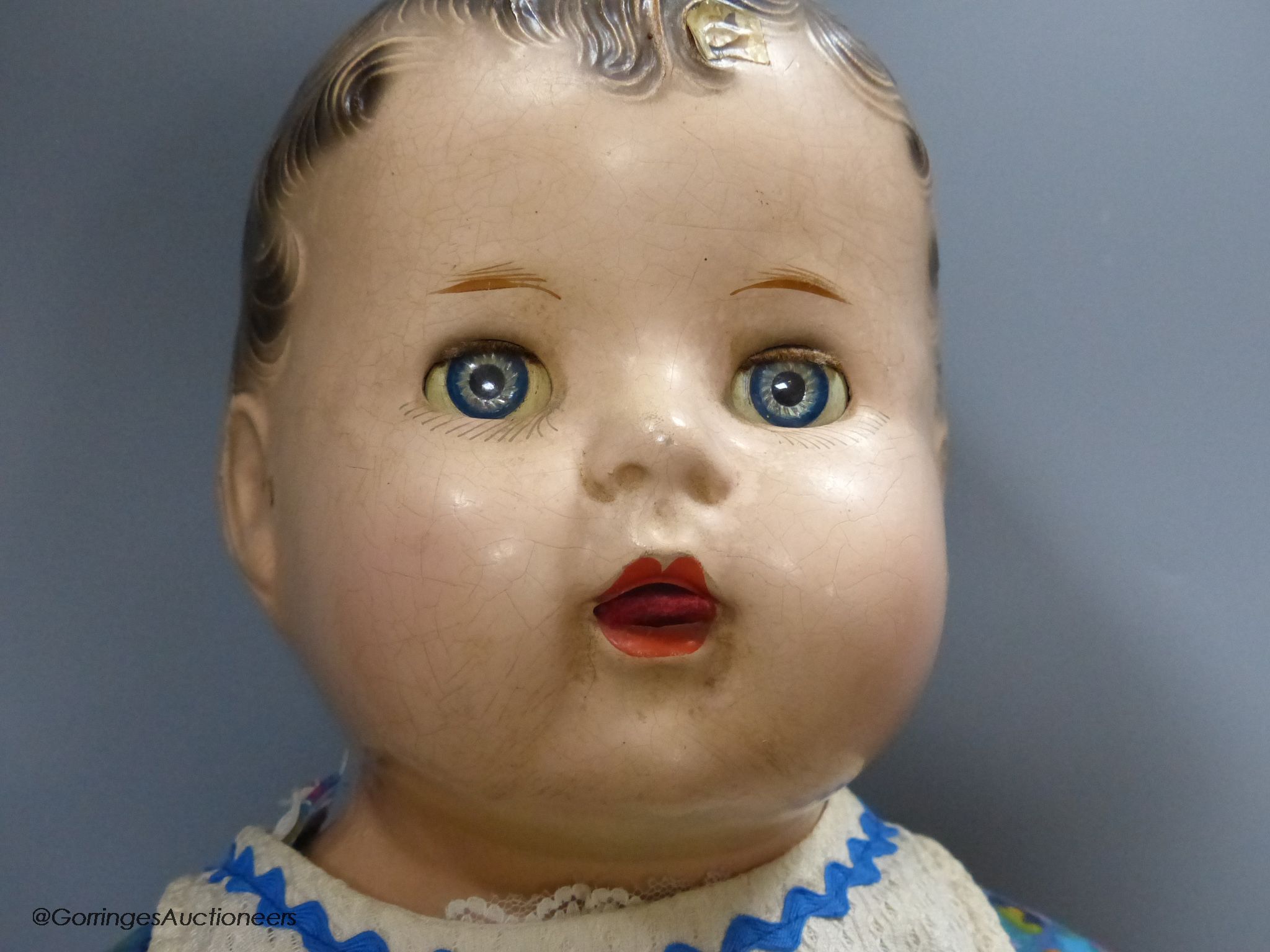 A Pelham puppet and a large Canadian composition doll, 59cm high.